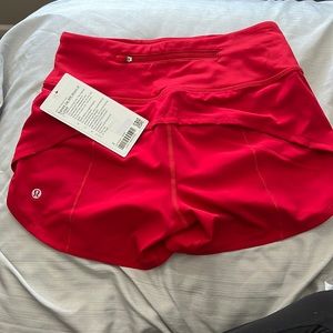 Selling red lululemon shorts for $65 brand new size 2